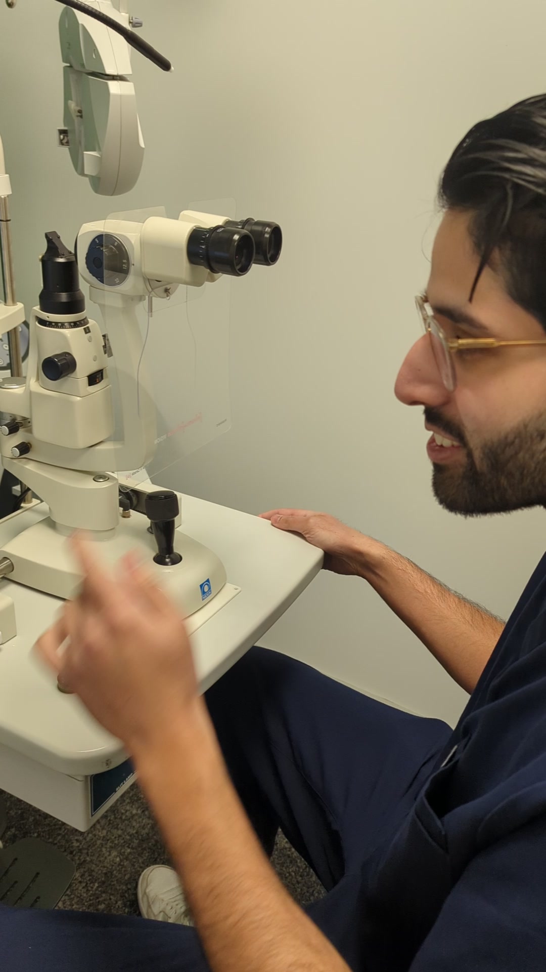 Dr. Munraj Bajwa at the slit lamp